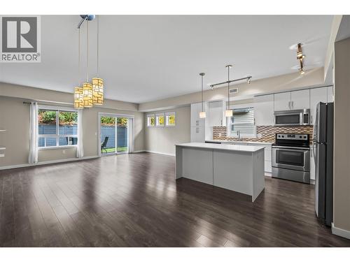 Kitchen, Living & Dining - 680 Old Meadows Road Unit# 86, Kelowna, BC - Indoor Photo Showing Kitchen With Upgraded Kitchen