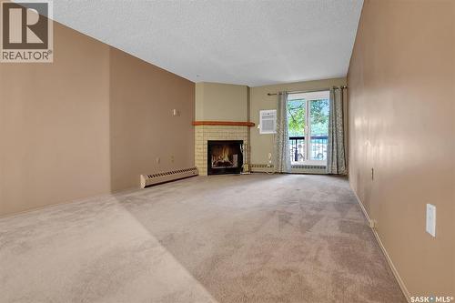 108 3420 Park Street, Regina, SK - Indoor With Fireplace