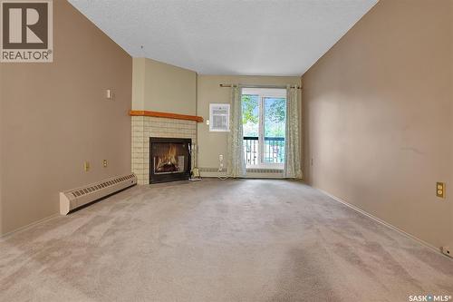 108 3420 Park Street, Regina, SK - Indoor With Fireplace