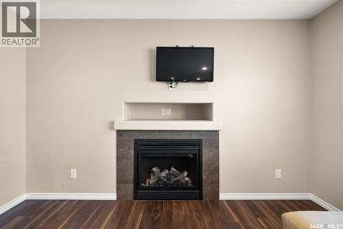 5113 Aerial Crescent, Regina, SK - Indoor Photo Showing Living Room With Fireplace
