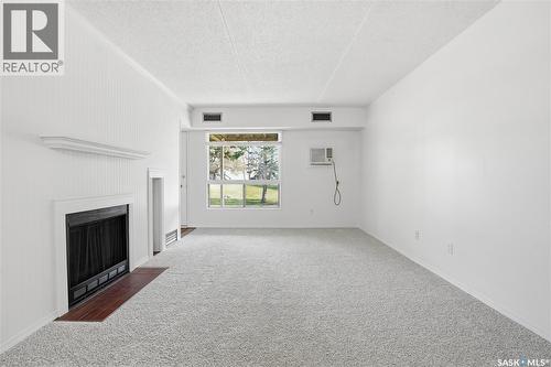 184 160 Gore Place, Regina, SK - Indoor Photo Showing Other Room With Fireplace