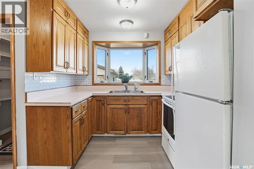 128 Yarnton Crescent, Regina, SK - Indoor Photo Showing Kitchen With Double Sink