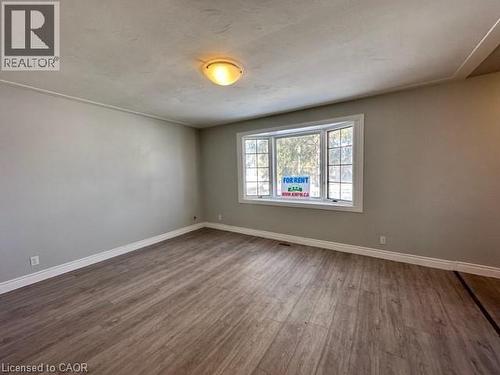 Unfurnished room featuring baseboards and wood finished floors - 121 Roberts Crescent Unit# Upper, Kitchener, ON - Indoor Photo Showing Other Room