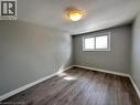 Spare room featuring baseboards and dark wood-style floors - 121 Roberts Crescent Unit# Upper, Kitchener, ON  - Indoor Photo Showing Other Room 