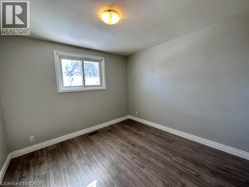 Spare room featuring baseboards and wood finished floors - 121 Roberts Crescent Unit# Upper, Kitchener, ON - Indoor Photo Showing Other Room