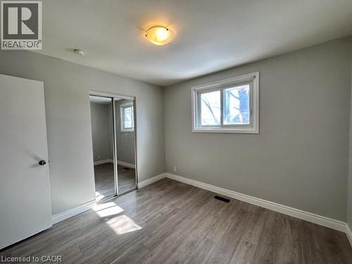 Unfurnished bedroom with light wood-style flooring and a closet - 121 Roberts Crescent Unit# Upper, Kitchener, ON - Indoor Photo Showing Other Room