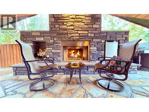 102 Sandner Road, Christina Lake, BC - Outdoor With Fireplace With Deck Patio Veranda