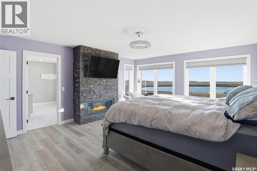 Toye Acreage, Grant Rm No. 372, SK - Indoor Photo Showing Bedroom With Fireplace