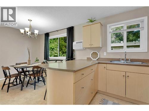 East Facing Windows For Morning Sunshine With Breakfast - 588 Mccurdy Road, Kelowna, BC - Indoor Photo Showing Kitchen With Double Sink