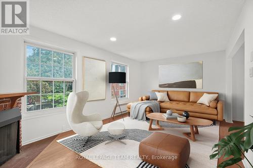 Virtually staged living room - 9 Moorside Private, Ottawa, ON - Indoor Photo Showing Living Room With Fireplace