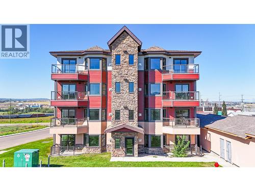 2032 86 Avenue Unit# 1102, Dawson Creek, BC - Outdoor With Balcony With Facade
