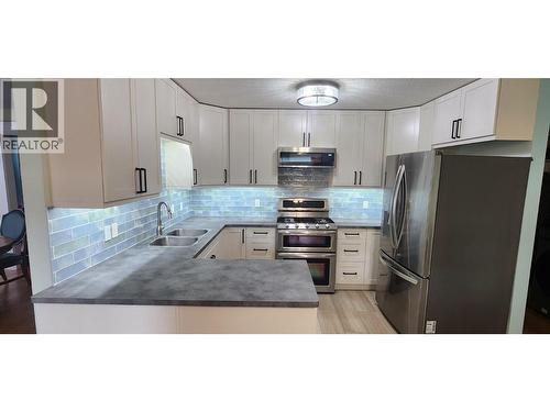 7766 18Th Street, Grand Forks, BC - Indoor Photo Showing Kitchen With Double Sink