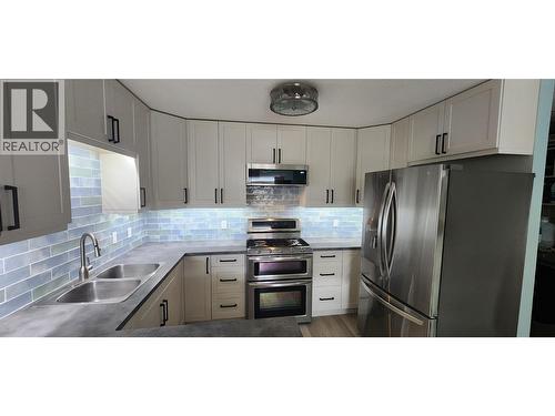 7766 18Th Street, Grand Forks, BC - Indoor Photo Showing Kitchen With Double Sink