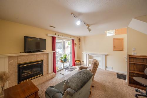 109-3400 Wilson Street, Penticton, BC - Indoor Photo Showing Living Room With Fireplace