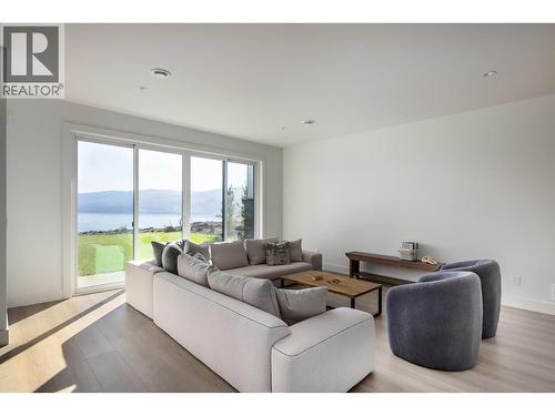 **Showhome photos - Actual home may differ in design, finishes, and features** - 4075 Sunstone Street, West Kelowna, BC - Indoor Photo Showing Living Room