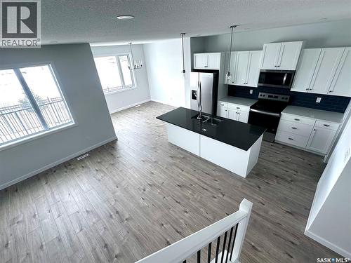 2953 Bellegarde Crescent, Regina, SK - Indoor Photo Showing Kitchen With Double Sink