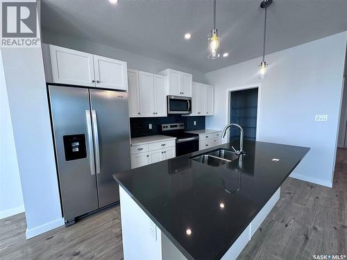 2953 Bellegarde Crescent, Regina, SK - Indoor Photo Showing Kitchen With Double Sink