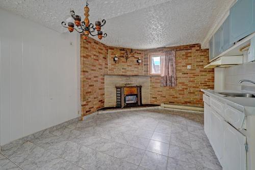 Salle à manger - 8913  - 15 2E Avenue, Montréal (Villeray/Saint-Michel/Parc-Extension), QC - Indoor With Fireplace