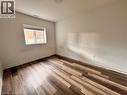 Unfurnished room featuring baseboards and wood finished floors - 205 West Oak Trail Unit# 66, Kitchener, ON  - Indoor Photo Showing Other Room 