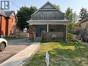 Traditional-style home with a porch and brick siding - 17 St Leger Street, Kitchener, ON  - Outdoor 