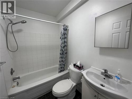 Full bathroom with shower / bath combo, vanity, and tile patterned flooring - 17 St Leger Street, Kitchener, ON - Indoor Photo Showing Bathroom
