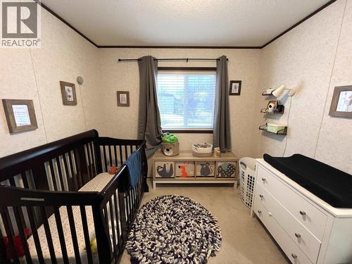 5506 Pine Crescent, Fort Nelson, BC - Indoor Photo Showing Bedroom