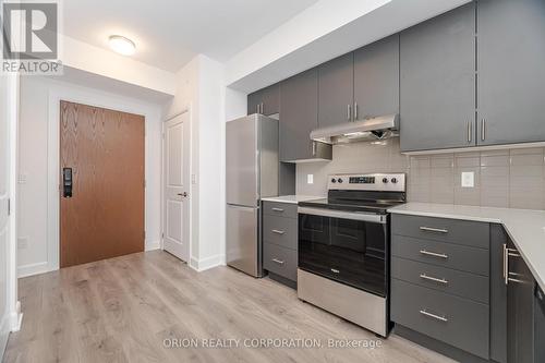 407 - 3240 William Coltson Avenue, Oakville, ON - Indoor Photo Showing Kitchen With Upgraded Kitchen