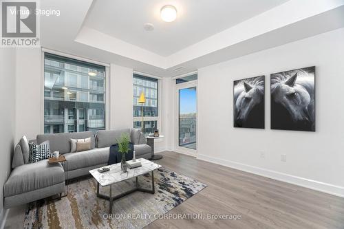 407 - 3240 William Coltson Avenue, Oakville, ON - Indoor Photo Showing Living Room