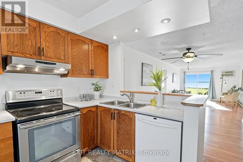 Open-concept layout w/ river views - 1C - 160 Edwards Street, Clarence-Rockland, ON - Indoor Photo Showing Kitchen With Double Sink