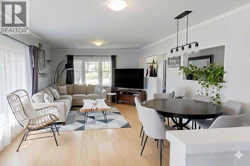 Living room digitally staged - 6487 Badger Street, Oliver, BC - Indoor