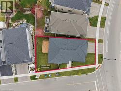 Aerial perspective of suburban area featuring property parcel outlined - 