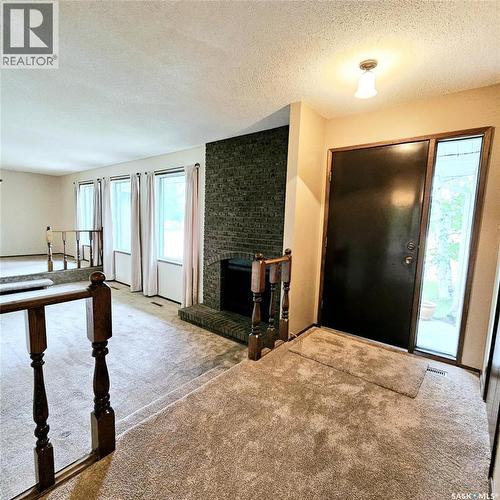 515 Grant Bay, Esterhazy, SK - Indoor Photo Showing Other Room With Fireplace