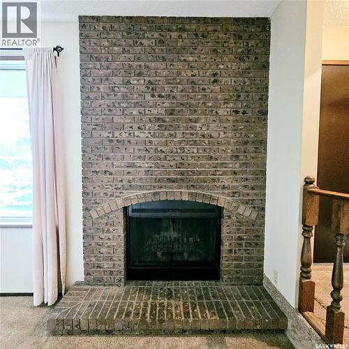 515 Grant Bay, Esterhazy, SK - Indoor Photo Showing Living Room With Fireplace