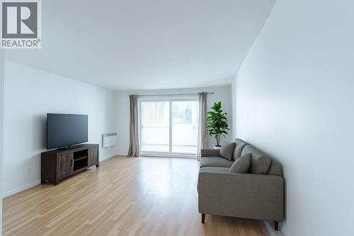Virtually Staged furniture - 445 All Star Court Unit# 106, Kelowna, BC - Indoor Photo Showing Living Room