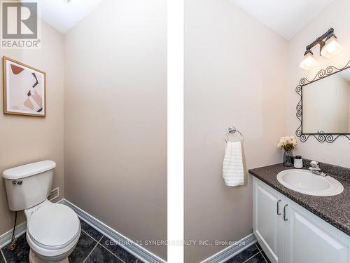 Powder room located by the stairs to the basement. - 34 Eliza Crescent, Ottawa, ON - Indoor Photo Showing Bathroom