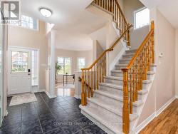 Bright front foyer with lovely big windows. - 