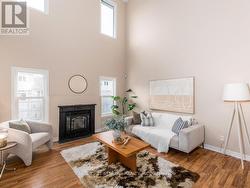 Main floor family room features 20 foot ceilings.. - 