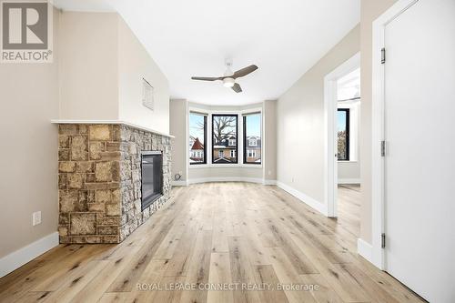 16 Rosemount Avenue, Toronto, ON - Indoor Photo Showing Other Room With Fireplace