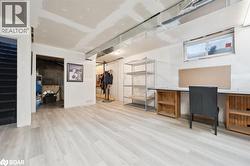 Office area featuring light wood-style floors - 