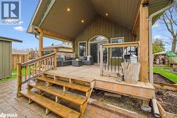 Wooden deck featuring outdoor lounge area - 