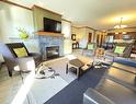 211D-200 Bighorn Boulevard, Radium Hot Springs, BC  - Indoor Photo Showing Living Room With Fireplace 