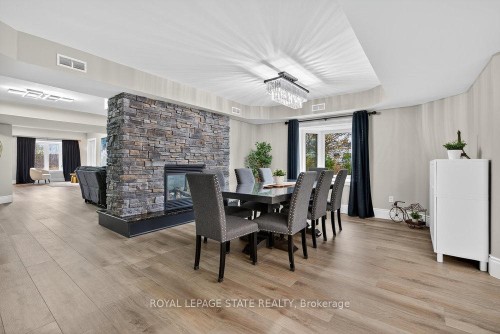 74 Green Mountain Road E, Hamilton, ON - Indoor Photo Showing Dining Room With Fireplace