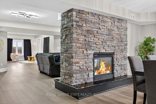 74 Green Mountain Road E, Hamilton, ON - Indoor Photo Showing Living Room With Fireplace