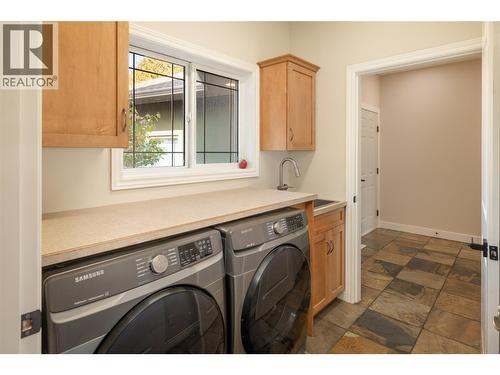 Spacious laundry with storage - 3356 Merlot Court, West Kelowna, BC - Indoor Photo Showing Laundry Room