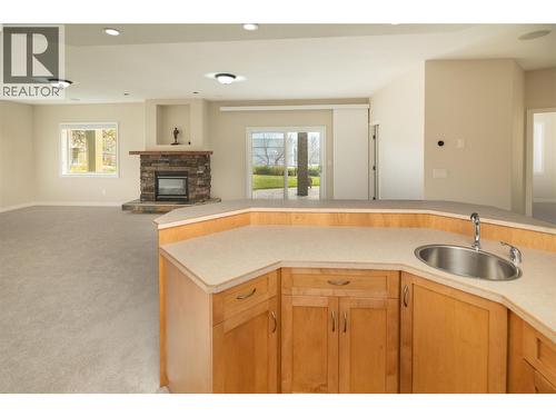 3356 Merlot Court, West Kelowna, BC - Indoor Photo Showing Kitchen With Fireplace