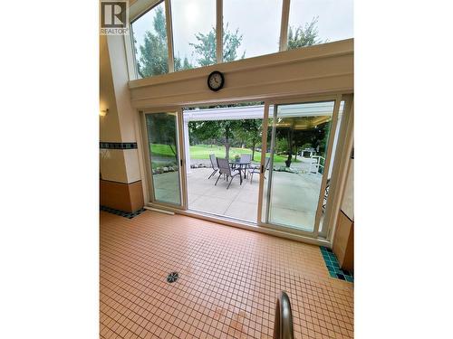 view of the 18th green from the pool. Swim and then relax and read while watching golfers - 3897 Gallaghers Grange, Kelowna, BC -  With Exterior