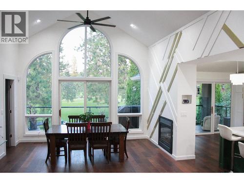 dining space with double sided fireplace - 3897 Gallaghers Grange, Kelowna, BC - Indoor Photo Showing Dining Room