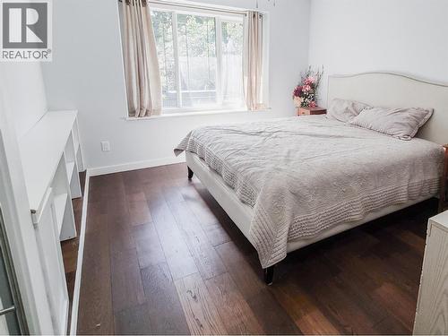 guest bed with custom built in shelving - 3897 Gallaghers Grange, Kelowna, BC - Indoor Photo Showing Bedroom