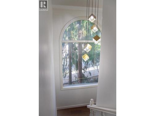 stairwell downstairs - 3897 Gallaghers Grange, Kelowna, BC - Indoor Photo Showing Other Room