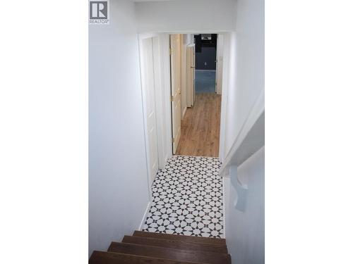 stairwell downstairs - 3897 Gallaghers Grange, Kelowna, BC - Indoor Photo Showing Other Room